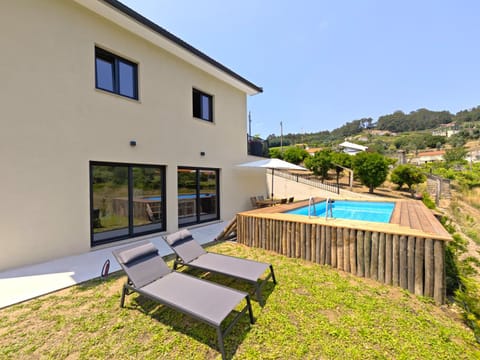 Property building, Patio, Day, Natural landscape, Pool view, Swimming pool, sunbed