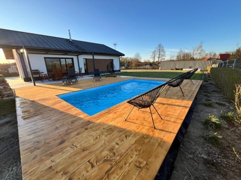 Property building, Patio, Day, Pool view, Swimming pool