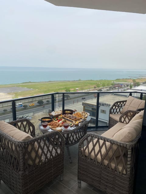 Patio, Day, Natural landscape, View (from property/room), Balcony/Terrace, Living room, Food and drinks, Seating area, Dining area, Food, Sea view