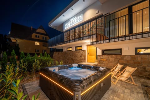 Property building, Patio, Night, Seating area, sunbed