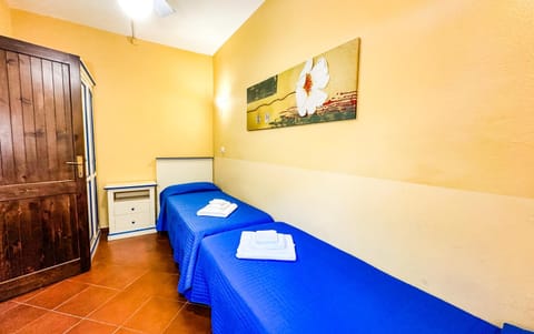 Bed, towels, wardrobe