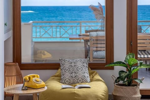 Natural landscape, View (from property/room), Living room, Seating area, Sea view