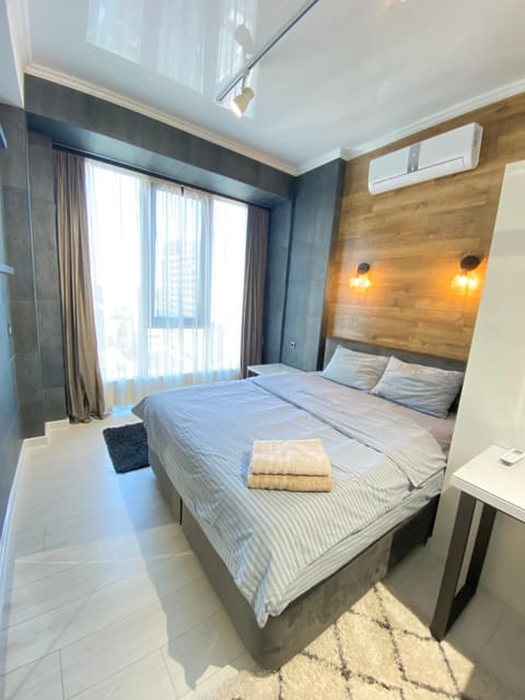 Bed, Photo of the whole room, Bedroom, towels, air conditioner