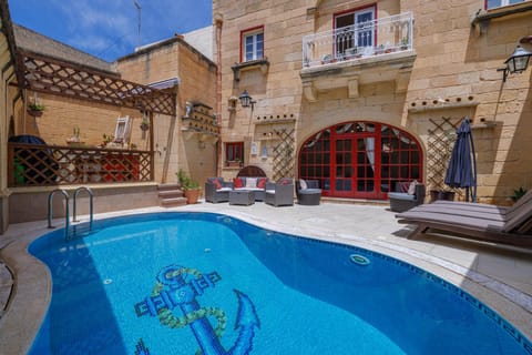 Property building, Patio, Day, Pool view, Swimming pool