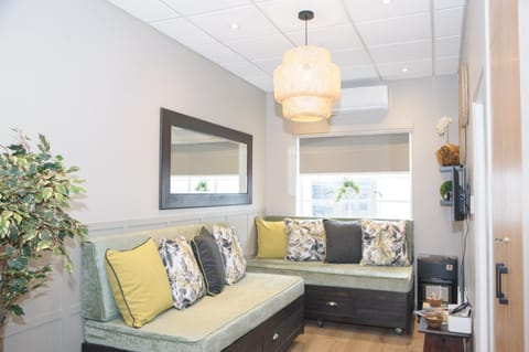 Bed, TV and multimedia, Living room, Seating area, locker, air conditioner