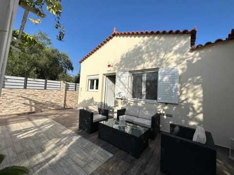 Property building, Patio, Day, Living room, Seating area