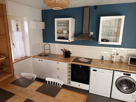 Kitchen or kitchenette, dishwasher, oven, stove, toaster, washing machine, dryer