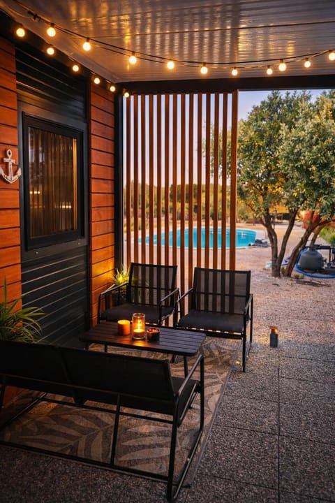 Patio, Day, Natural landscape, Living room, Seating area, Pool view, Swimming pool, sunbed