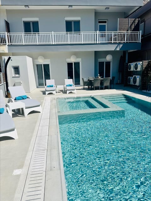 Property building, Patio, Day, View (from property/room), Pool view, Swimming pool, Swimming pool, sunbed