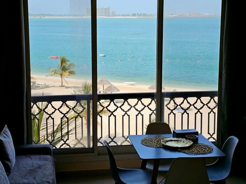 View (from property/room), Living room, Seating area, Dining area, Beach, Sea view
