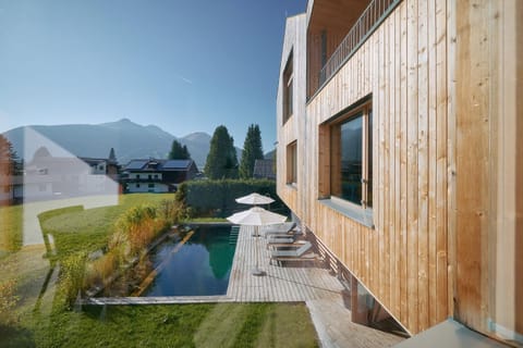 Property building, Patio, Garden, Garden view, Pool view, Swimming pool, sunbed