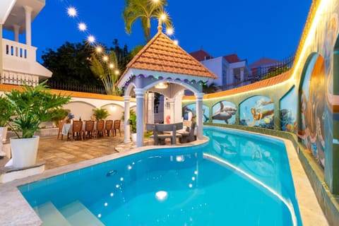 Property building, Patio, Night, Pool view, Swimming pool, sunbed