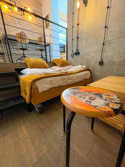 Bed, Living room, Seating area, Bedroom