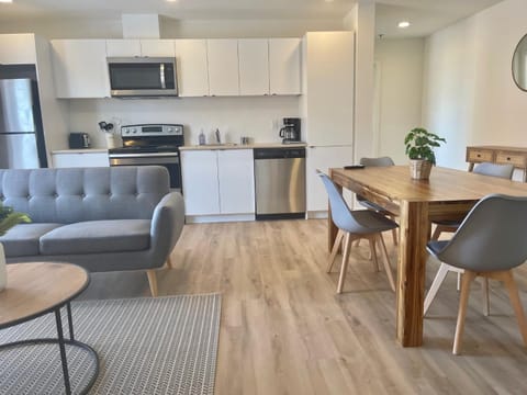 Kitchen or kitchenette, Living room, Seating area, Dining area, dishwasher, oven, stove, toaster