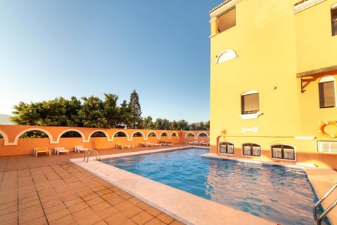 Property building, Living room, Swimming pool