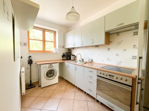 Kitchen or kitchenette, oven, stove, washing machine