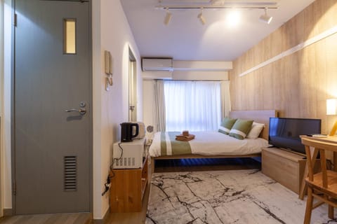 Bed, TV and multimedia, Seating area, Bedroom, air conditioner