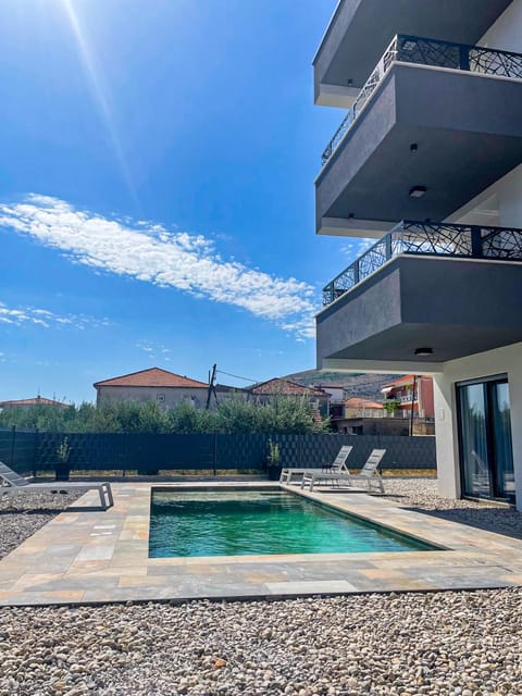 Property building, Pool view, Swimming pool, sunbed