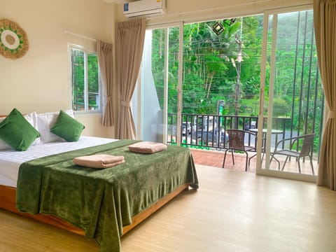 Bed, Garden, View (from property/room), Balcony/Terrace, Bedroom, Garden view, towels, air conditioner