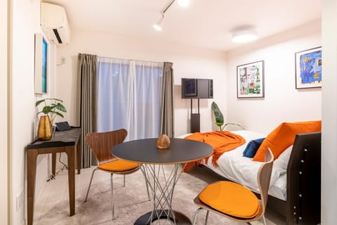 Bed, TV and multimedia, Seating area, Bedroom, air conditioner