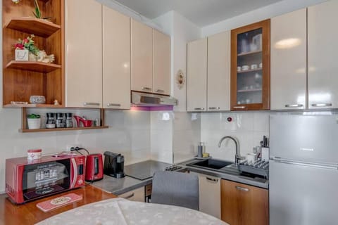 Kitchen or kitchenette, dishwasher, oven, stove, toaster