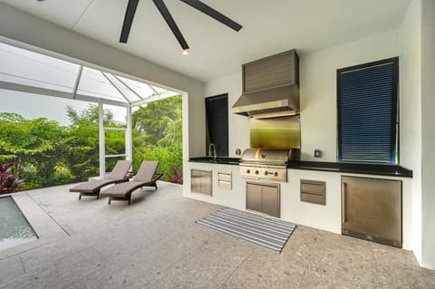 Contemporary Naples Home with Outdoor Kitchen and Pool House in East Naples