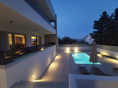 Property building, Patio, Night, View (from property/room), On site, Pool view, Swimming pool, sunbed