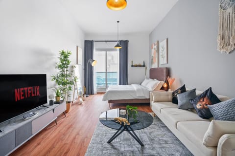 Bed, TV and multimedia, Living room, Seating area, Bedroom