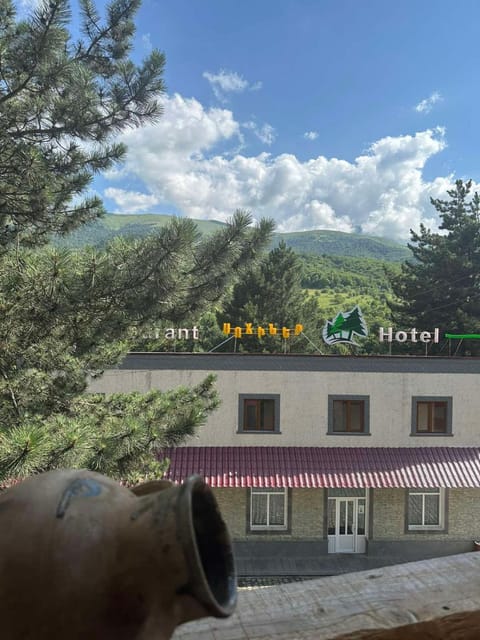 Property building, Day, Natural landscape, Text overlay, Mountain view
