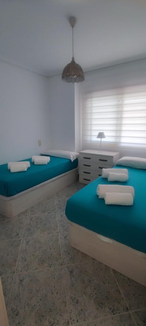 Acogedor apartamento en Daimús a 150 metros de la playa con parking privado y piscinas comunitarias Apartment in Daimús