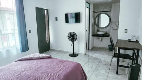 Bed, TV and multimedia, Seating area, Bedroom