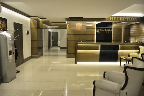 Communal lounge/ TV room, People, Property logo or sign, View (from property/room), Lobby or reception