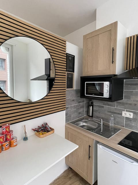 Kitchen or kitchenette, microwave, stove, kitchen