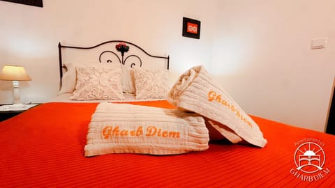 Bed, Property logo or sign, Bedroom, towels