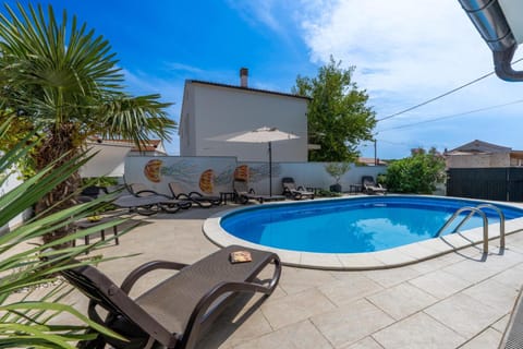 Patio, Day, Natural landscape, Pool view, Swimming pool, sunbed