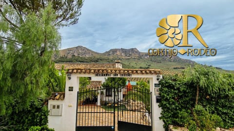 Property building, Nearby landmark, Facade/entrance, Property logo or sign, Natural landscape, Logo/Certificate/Sign, Text overlay, Mountain view