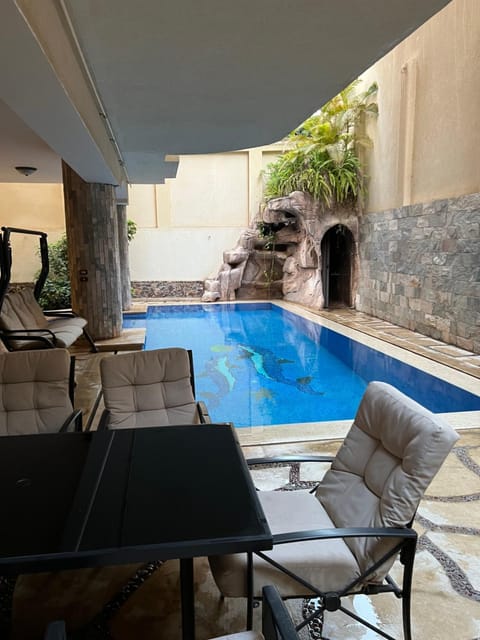 Patio, Day, Seating area, Pool view, Swimming pool, sunbed