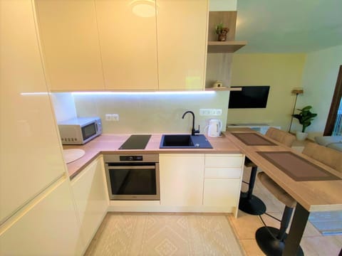 Kitchen or kitchenette, oven, stove, toaster