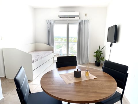 Communal lounge/ TV room, Bed, TV and multimedia, Living room, Photo of the whole room, Seating area, Dining area, Family, air conditioner