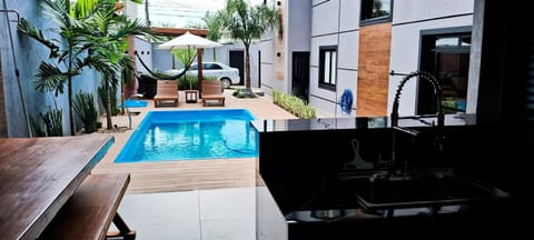 Property building, Patio, Day, Evening entertainment, Pool view, Swimming pool, sunbed