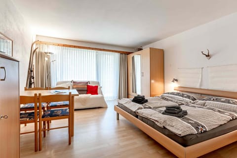 Bed, Photo of the whole room, Seating area, Bedroom, towels, wardrobe