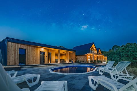 Property building, Night, Natural landscape, Pool view, Swimming pool, sunbed
