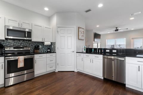 Kitchen or kitchenette, dishwasher, oven, stove