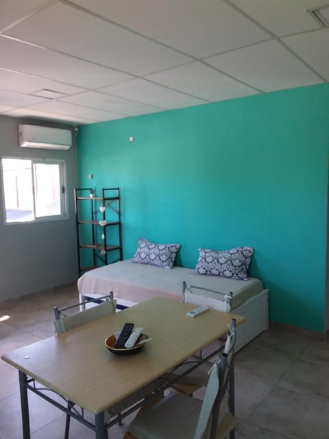 Bed, Living room, Seating area, Dining area