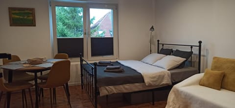 Bed, Living room, Seating area, Bedroom