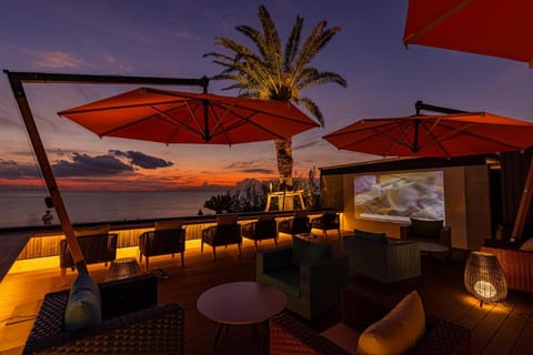Natural landscape, View (from property/room), Balcony/Terrace, Seating area, Sea view, Sunset