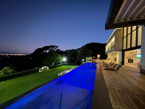 Property building, Patio, Night, Natural landscape, Garden, Garden view, Swimming pool, sunbed