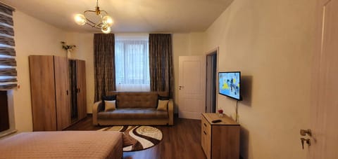 Bed, TV and multimedia, Seating area, Bedroom, hair dresser, wardrobe