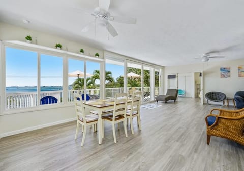 View (from property/room), Living room, Seating area, Dining area, Sea view