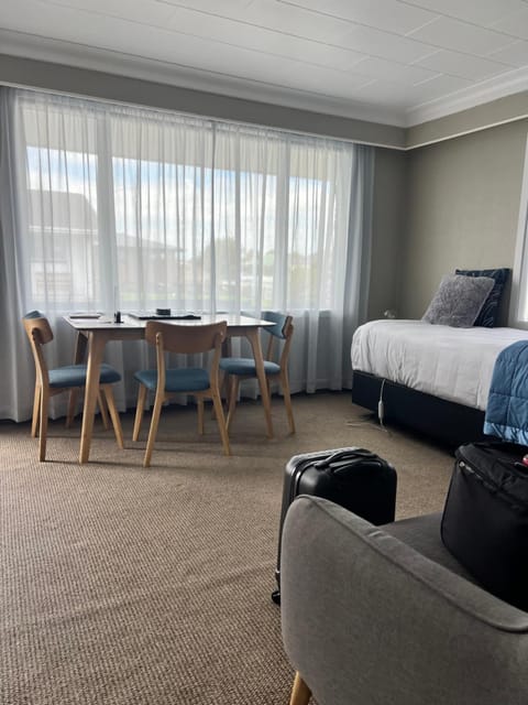 Bed, Living room, Seating area, Dining area